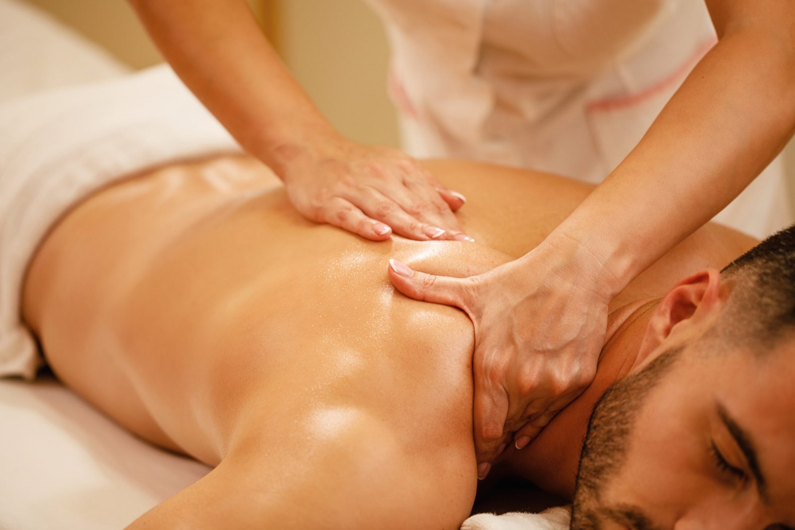 closeup-man-having-back-massage-during-spa-treatment-wellness-center-scaled.jpg