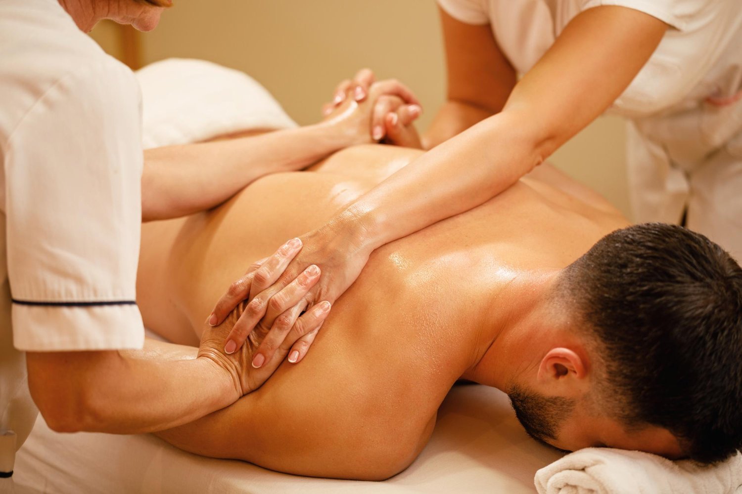 unrecognizable-massage-therapists-massaging-together-man-s-back-health-spa.jpg